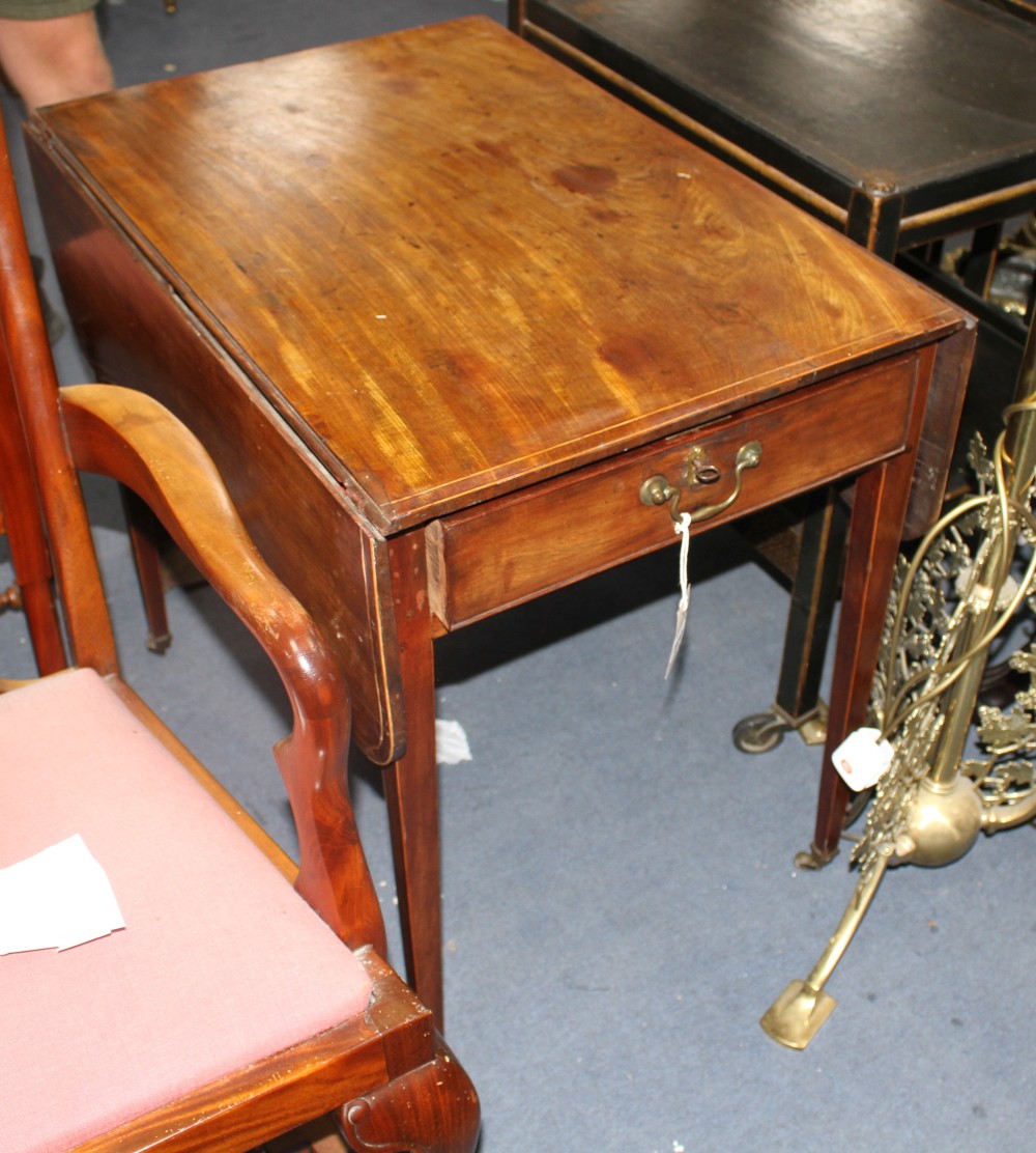 A George III strung mahogany butterfly wing mahogany table, with frieze drawers and squared tapered legs, W.76cm D.52cm H.70cm